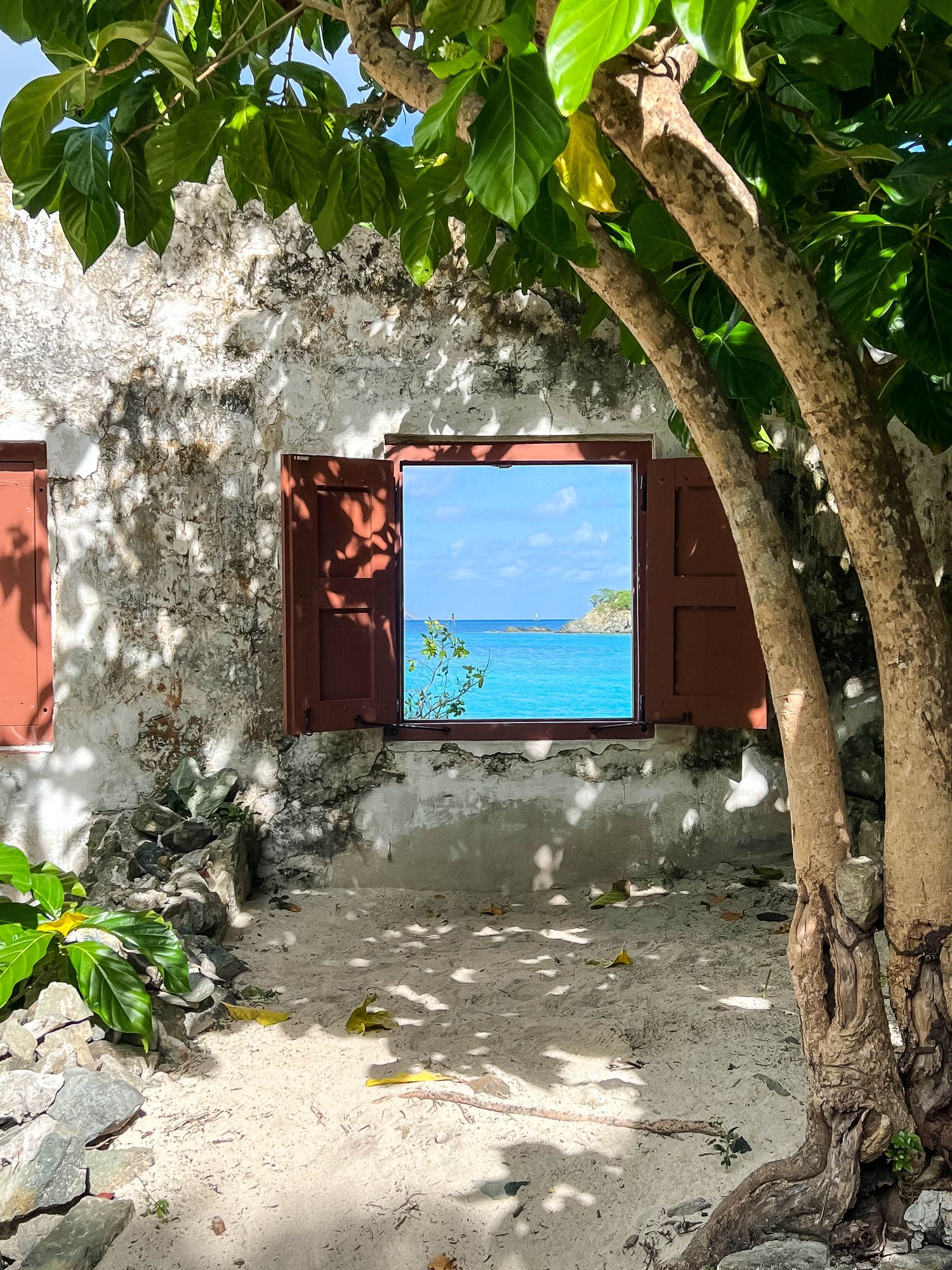 Beach view framed by historic sugar estate ruins at Cinnamon Bay, St. John